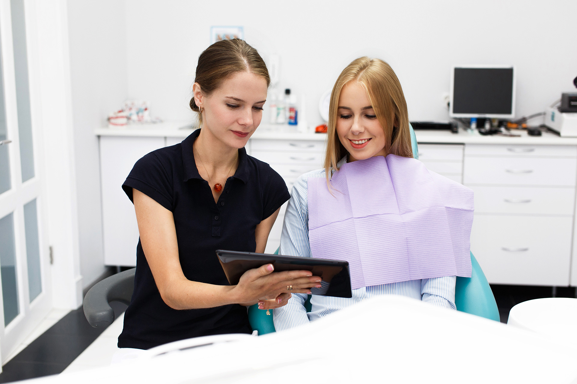 woman-sits-chair-dentist-office